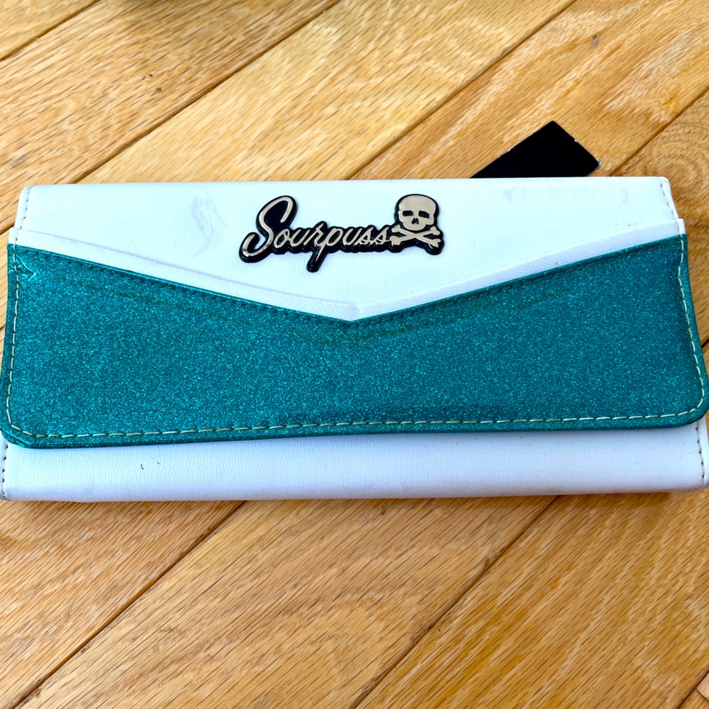 Brand new Sourpuss wallet. Blue glitter